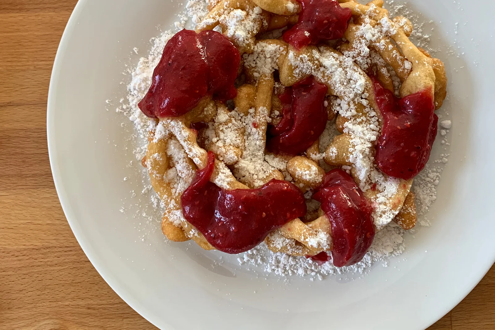 Homemade Funnel Cake with Cranberry Coulis